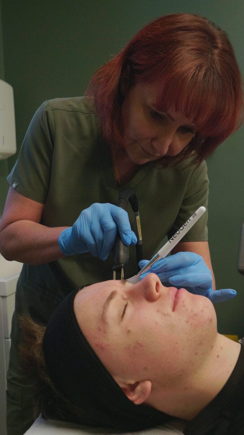 Dawn Richardson treating a client's blemish-prone skin at Dawn Clinic
